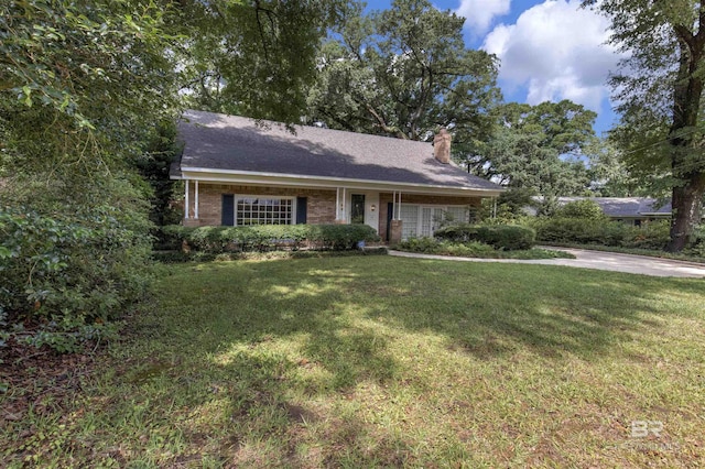 52 N Hawthorne Pl, Mobile, AL 36608 - ranch-style home with a chimney, a front yard, and brick siding