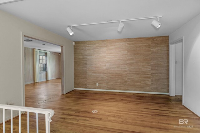 52 N Hawthorne Pl, Mobile, AL 36608 - unfurnished room featuring track lighting, light wood-style flooring, and baseboards