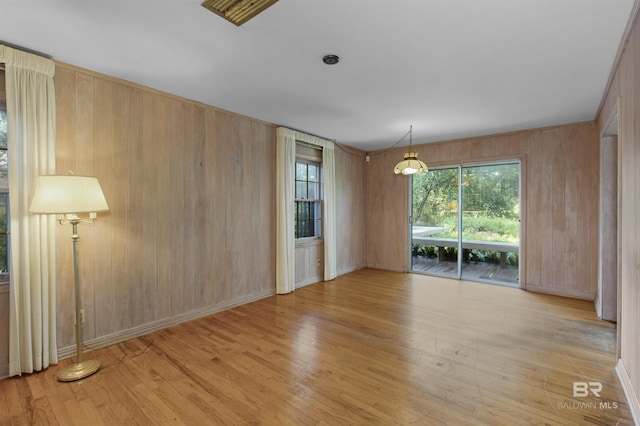 52 N Hawthorne Pl, Mobile, AL 36608 - unfurnished room with wooden walls, wood finished floors, and baseboards