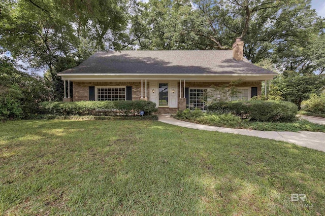 52 N Hawthorne Pl, Mobile, AL 36608 - ranch-style home with a front lawn, a chimney, and brick siding