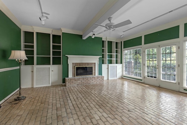 52 N Hawthorne Pl, Mobile, AL 36608 - unfurnished living room with a ceiling fan, a brick fireplace, brick patterned flooring, and crown molding