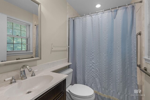 52 N Hawthorne Pl, Mobile, AL 36608 - bathroom featuring toilet, vanity, and a shower with curtain