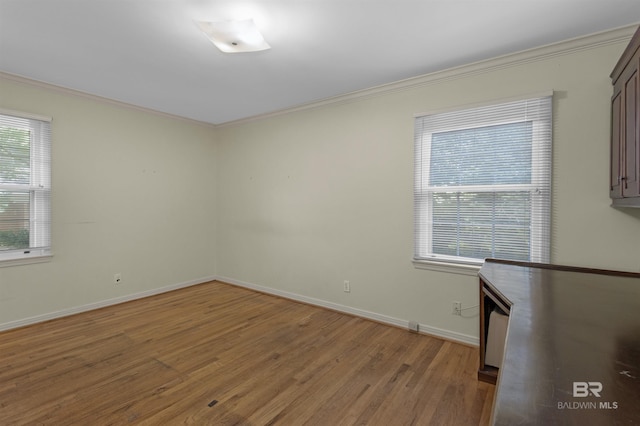 52 N Hawthorne Pl, Mobile, AL 36608 - unfurnished room featuring light wood finished floors, ornamental molding, and baseboards