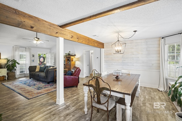 117 Richmond Rd, Daphne, AL 36526 - dining room with a textured ceiling, wood walls, beam ceiling, wood finished floors, and ceiling fan