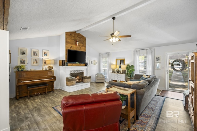 117 Richmond Rd, Daphne, AL 36526 - living area with a brick fireplace, a ceiling fan, wood finished floors, and a textured ceiling