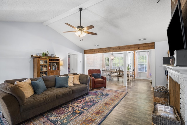 117 Richmond Rd, Daphne, AL 36526 - living room featuring wood finished floors, a textured ceiling, a ceiling fan, and a fireplace