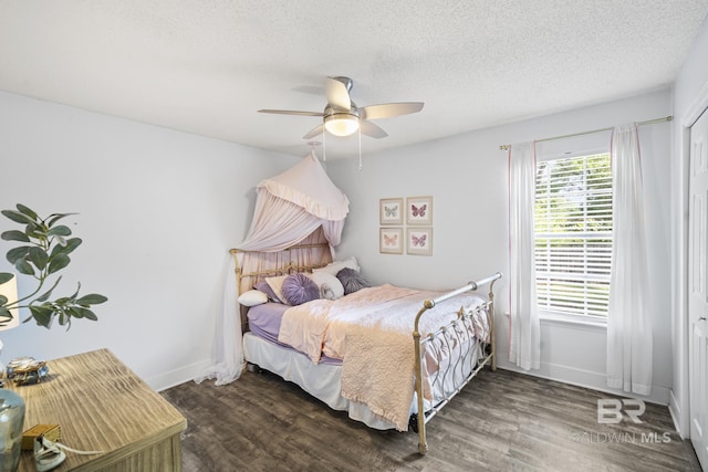 117 Richmond Rd, Daphne, AL 36526 - bedroom featuring wood finished floors, a ceiling fan, a textured ceiling, and baseboards
