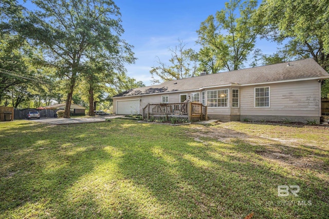 117 Richmond Rd, Daphne, AL 36526 - rear view of property featuring a garage, a wooden deck, driveway, and a chimney