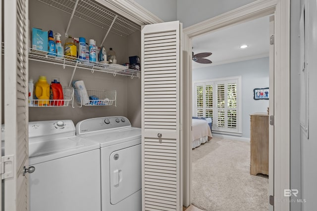 laundry area featuring carpet flooring, washing machine and dryer, and ceiling fan