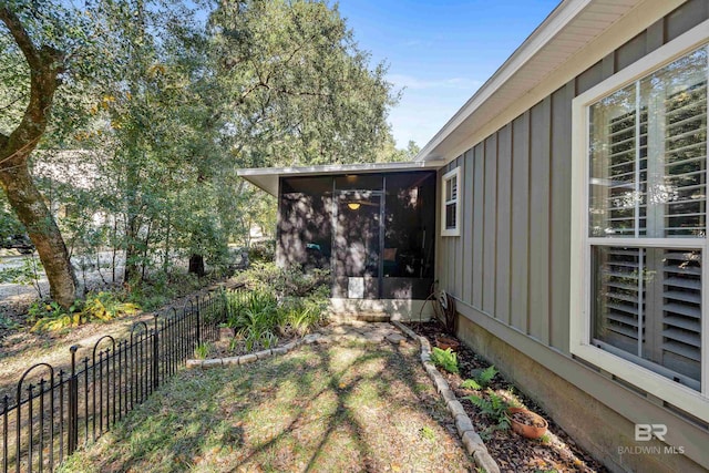 view of yard featuring a sunroom