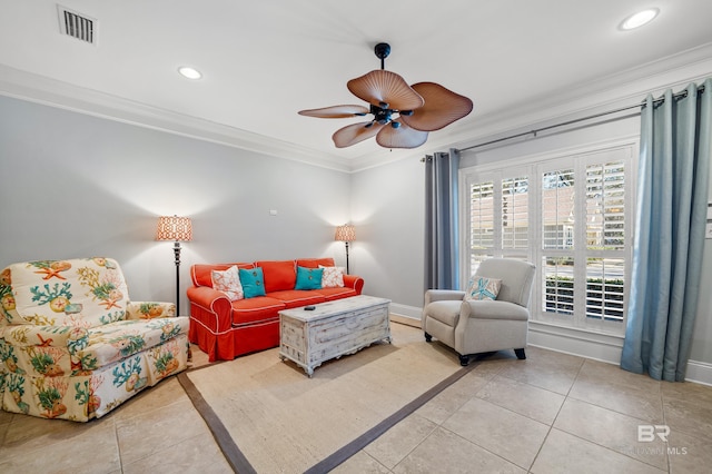 living room featuring crown molding, ceiling fan, and light tile patterned floors