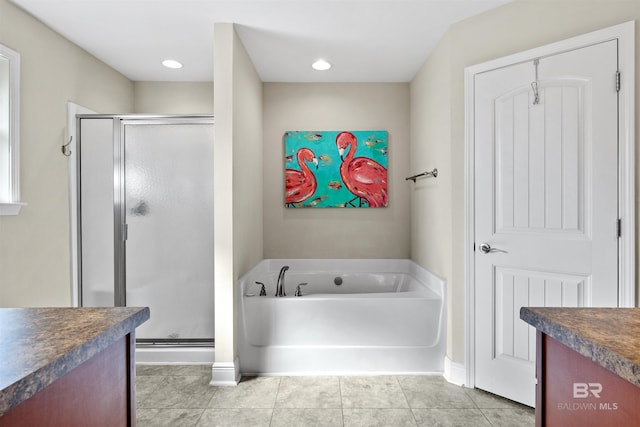 bathroom featuring vanity, shower with separate bathtub, and tile patterned flooring