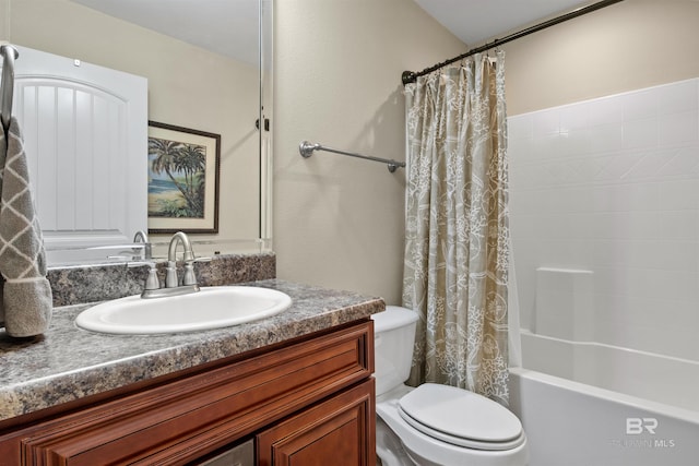 full bathroom featuring vanity, shower / bathtub combination with curtain, and toilet