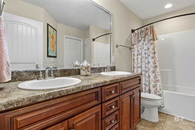 full bathroom featuring shower / bath combination with curtain, vanity, toilet, and tile patterned flooring