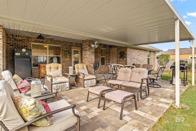 view of patio featuring an outdoor living space and ceiling fan