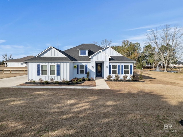 modern farmhouse with a front lawn