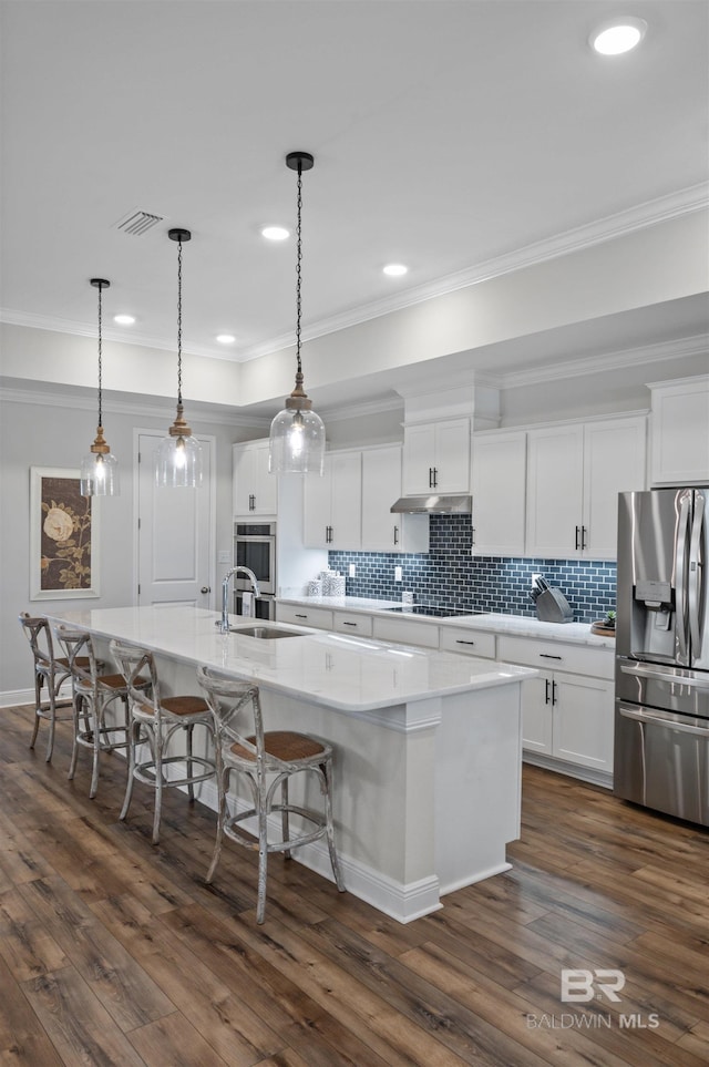 kitchen featuring stainless steel refrigerator with ice dispenser, a large island, and white cabinets