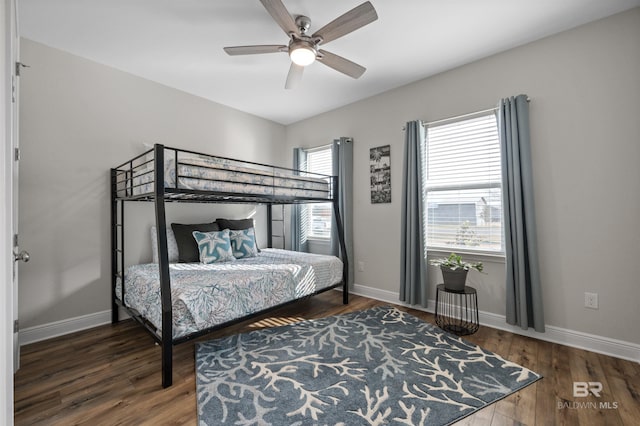 bedroom featuring dark wood-type flooring and ceiling fan