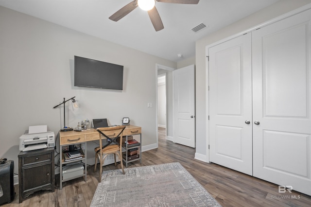 office space featuring dark hardwood / wood-style floors and ceiling fan