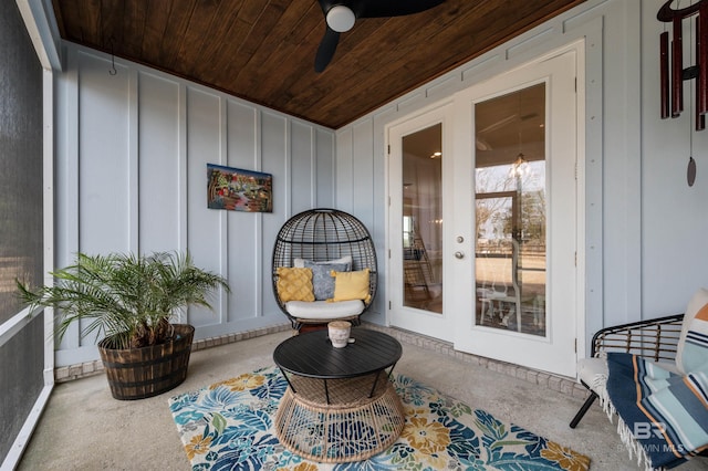 sunroom with wooden ceiling and ceiling fan