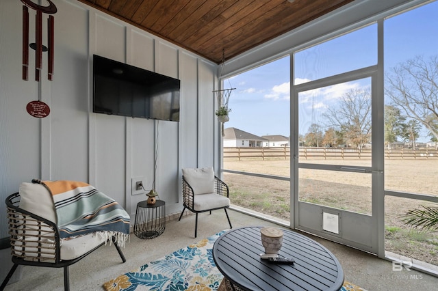 sunroom / solarium featuring wooden ceiling