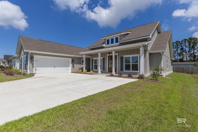 view of front of home featuring board and batten siding, concrete driveway, a shingled roof, and a porch