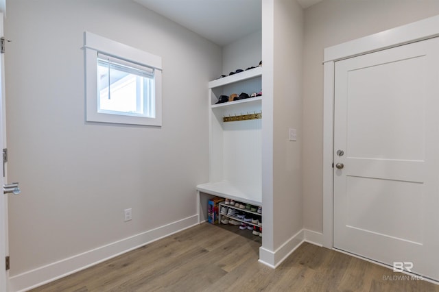 mudroom with baseboards and wood finished floors