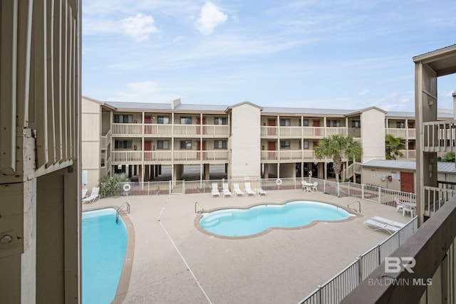 view of swimming pool with a patio