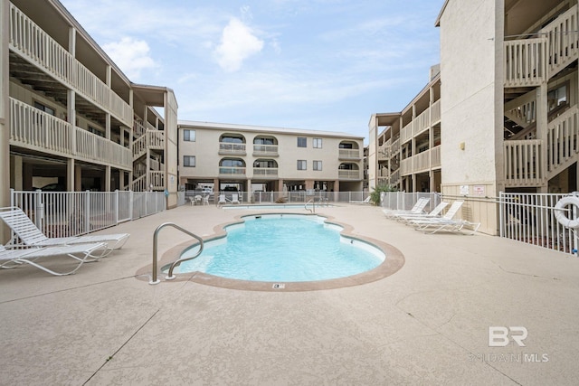 view of pool featuring a patio area