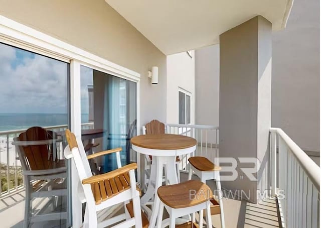 balcony featuring a water view
