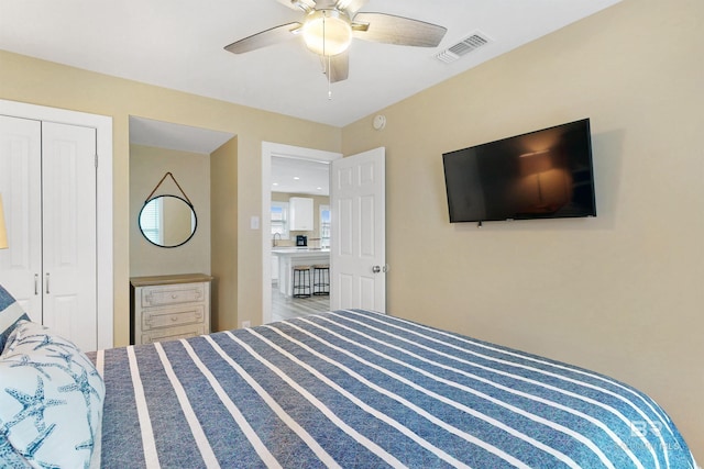 bedroom featuring carpet floors, a closet, and ceiling fan