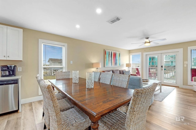 dining space featuring light wood-type flooring, french doors, plenty of natural light, and ceiling fan