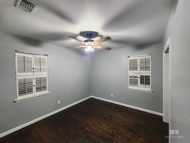 empty room featuring ceiling fan and hardwood / wood-style flooring