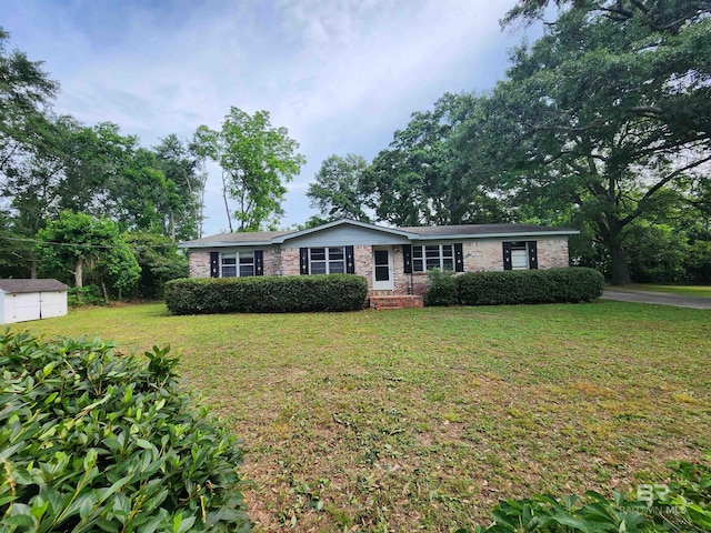 ranch-style home with a front lawn