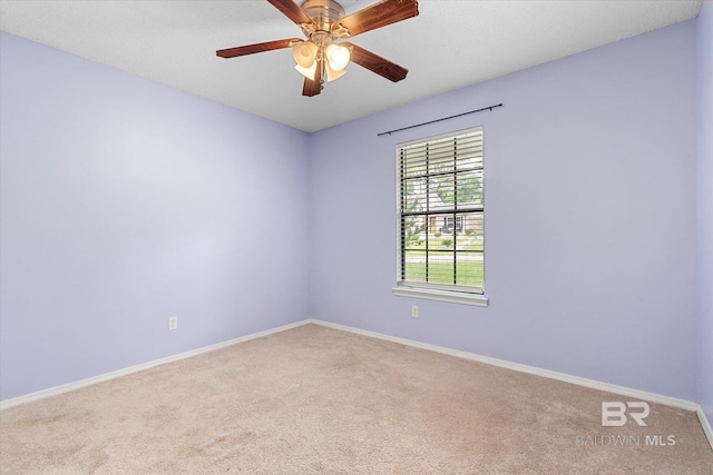 5645 Green Tree Rd, Mobile, AL 36609 - carpeted spare room featuring baseboards and a ceiling fan
