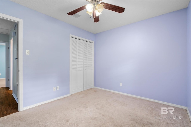 5645 Green Tree Rd, Mobile, AL 36609 - unfurnished bedroom with carpet, a closet, baseboards, and a ceiling fan