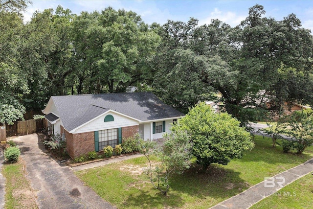 5645 Green Tree Rd, Mobile, AL 36609 - view of front facade with brick siding and asphalt driveway