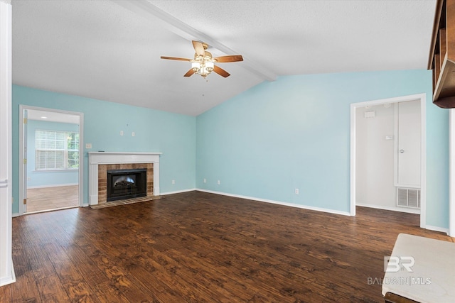 5645 Green Tree Rd, Mobile, AL 36609 - unfurnished living room featuring ceiling fan, wood-type flooring, a fireplace, baseboards, and a textured ceiling