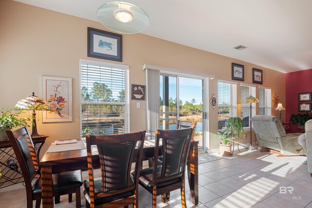 dining space with light tile patterned floors