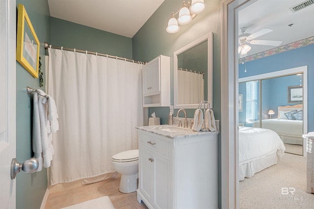 bathroom featuring tile patterned floors, ceiling fan, toilet, and vanity