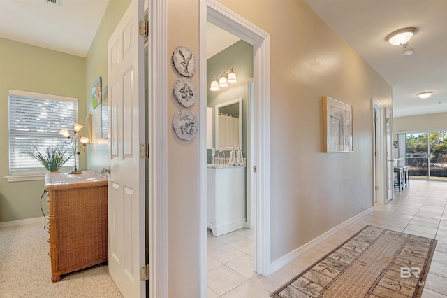 hallway featuring light tile patterned flooring