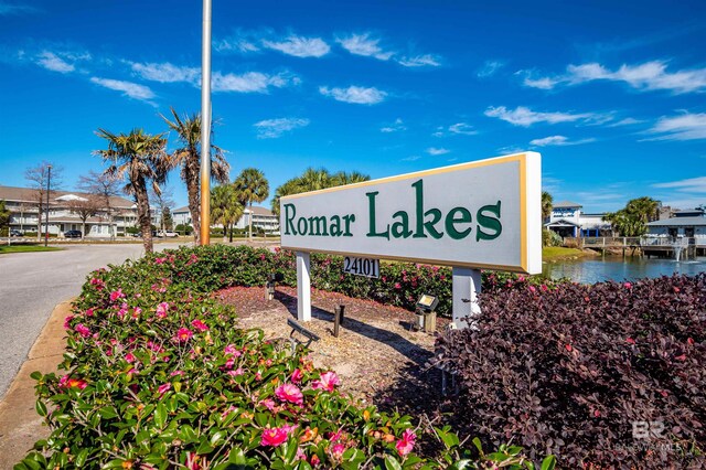 community sign with a water view