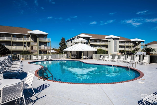 view of swimming pool with a patio