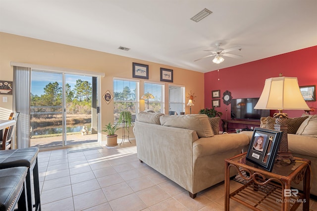 tiled living room featuring ceiling fan