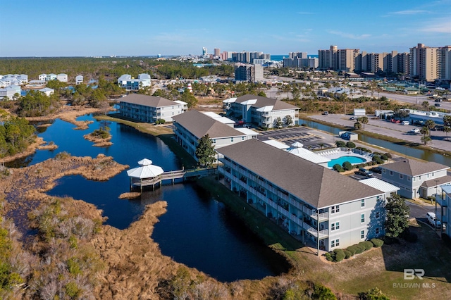 birds eye view of property with a water view