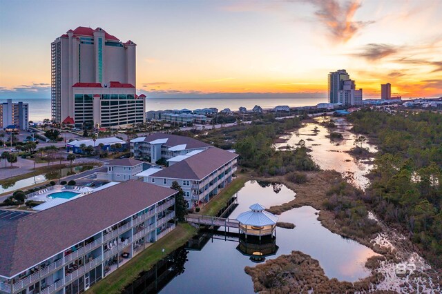 aerial view at dusk with a water view