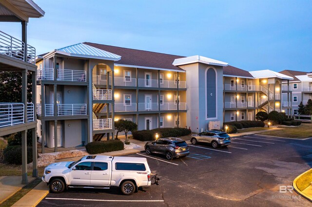 view of outdoor building at dusk