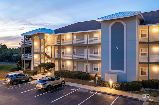 view of outdoor building at dusk