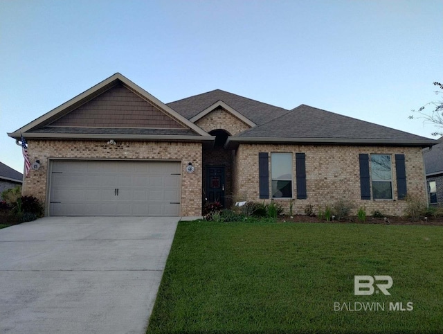 ranch-style house featuring a garage and a front lawn