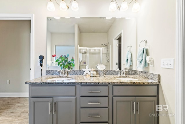 bathroom featuring vanity and an enclosed shower